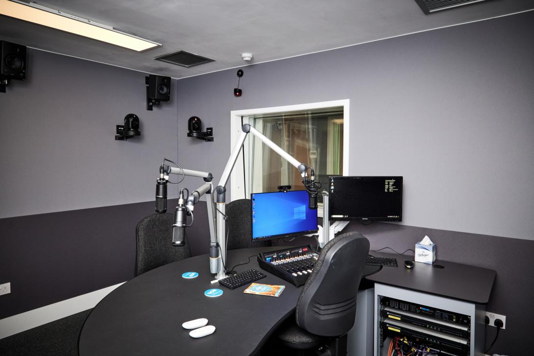 The inside of a UCB radio booth